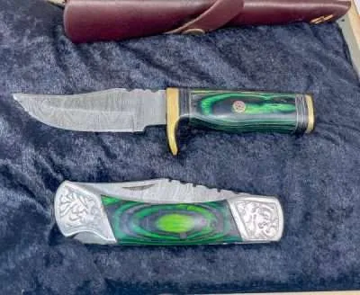 Laminated green wood handle with Steel engraved bolster and endcap on Damascus steel blade Laminated green wood handle with black wood spacers and Brass bolster and endcap on Damascus steel blade