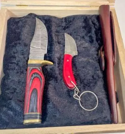Laminated red wood handle with Brass bolster and endcap on Damascus steel blade Laminated red wood handle with Brass bolster and endcap on Damascus steel blade